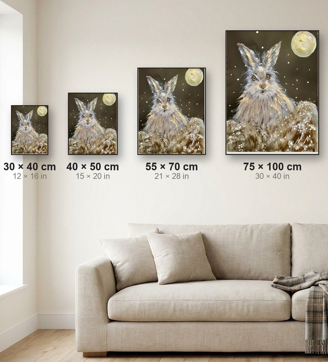 Print size guide showing 30x40, 40x50, 55x70 and 75x100 cm canvas prints to scale on a living-room wall
